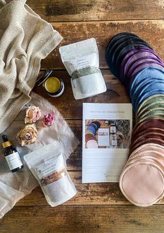 the contents of a sock laid out on a wooden floor next to an open book