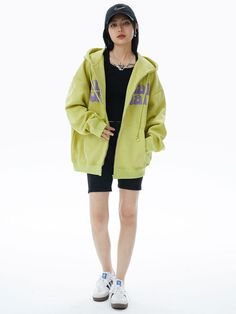 Make a bold statement with our Lime Green Graphic Zip Hoodie. This eye-catching sweatshirt features a vibrant lime green base with contrasting purple text across the chest. The playful typography design includes quirky eye graphics, adding a unique touch. With a comfortable fit, full-zip front, and kangaroo pockets, this hoodie combines style and practicality. Perfect for those who love standout streetwear with a fun twist, it's ideal for casual outings or lounging in style. The hoodie's bright Oversized Green Hoodie For Streetwear, Green Hooded Sweatshirt For Streetwear, Casual Green Hoodie With Logo Print, Green Cotton Hoodie For Streetwear, Green Cotton Hip Hop Hoodie, Green Hooded Sweatshirt With Logo Print, Green Hip Hop Hoodie With Crew Neck, Green Crew Neck Hoodie In Hip Hop Style, Green Cotton Hoodie With Graphic Print