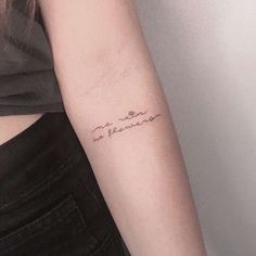 a woman's arm with a tattoo that reads, i am not in love