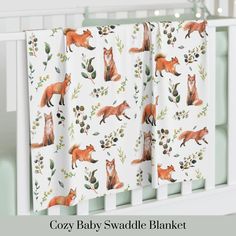 a baby crib bedding set with foxes and leaves