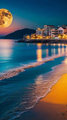 a full moon is seen over the ocean and beach in this beautiful photo taken at night