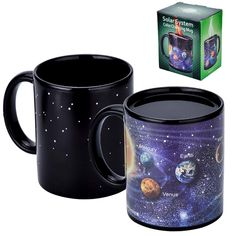 a black coffee mug with the outer planets printed on it and a box next to it