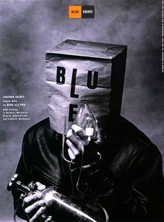 a person with a paper bag on their head holding a wine bottle in front of his face