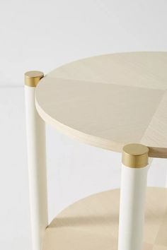 a table with two white and gold legs