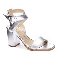 This sandal is a sleek statement style, that is easily transeasonal. It features a shining silver with criss cross buckle strap.Designer InformationRanging from dressy heels to casual flats, this footwear company serves the free millenial woman on the go. The textures and patterns represent a fun, modern and feminine style. Dressy Flats Shoes, Chinese Laundry Shoes, Silver Sandals, Chinese Laundry, Casual Flats, Pump Sandals, Feminine Style, Criss Cross, Heeled Mules