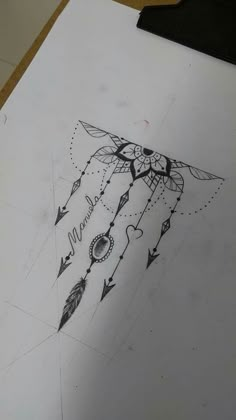 a drawing of a dream catcher with arrows