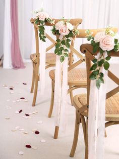 the chairs are decorated with flowers and ribbons