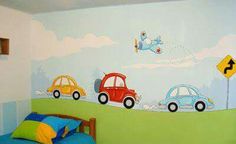 a child's bedroom with cars painted on the wall