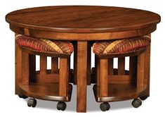 a wooden table with two chairs around it and a round dining room table on casteors