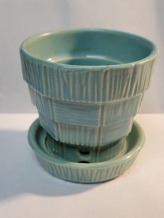 two blue bowls sitting on top of each other