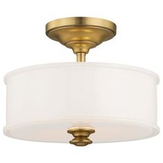 a light fixture with a white shade on the bottom and a gold finish to it