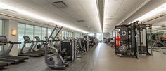 an empty gym with treadmills and exercise machines