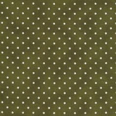 a green and white polka dot fabric with small white dots on the top of it