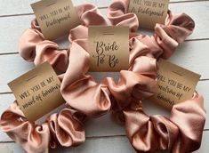 the bride to be hair scrunffles are shown in pink and gold colors