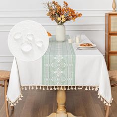 the table is set for two with plates and flowers