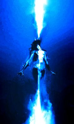 a woman is floating in the blue water