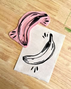 a piece of paper with a drawing of a banana on it