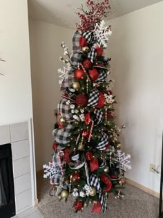 a christmas tree decorated with red, white and silver ornaments