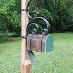 a mailbox attached to a wooden post