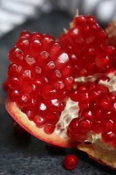 the pomegranate is cut in half and ready to be eaten