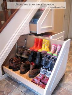 an under the stairs shoe rack holds many pairs of shoes