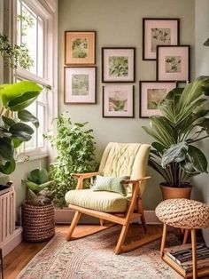 a living room filled with lots of plants and pictures on the wall above a chair