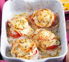 some food in a white dish on a table