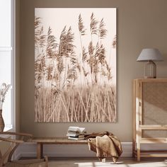 a living room with a couch, chair and painting on the wall in front of it