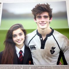 a young man and woman are posing for a photo in front of a news paper