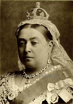 an old black and white photo of a woman wearing a tiara