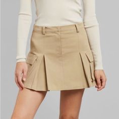 This Skirt Is Brand New With Tags. Chic Skirted Skort With Pockets, Chic Fitted Mini Cargo Skirt, Chic Fitted Cargo Skirt For Fall, Spring Lined Cargo Skirt, Chic Flared Skort With Pockets, Chic Skort With Pockets And Flared Skirt, Spring Mini Length Relaxed Cargo Skirt, Chic Tiered Skirt With Pockets, Chic Fitted Beige Cargo Skirt