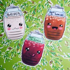 three stickers that have different types of drinks in them on a green tablecloth