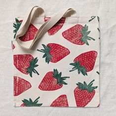 a bag with strawberries printed on it