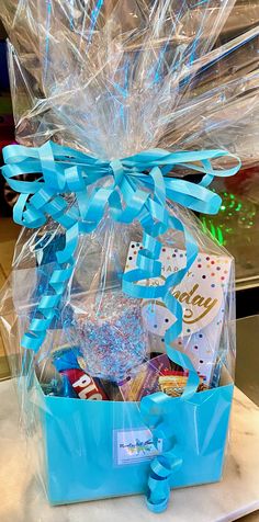 a blue gift box filled with candy and candies