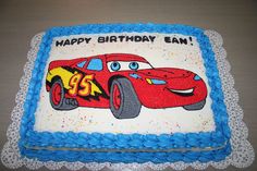 a birthday cake with a red car on it