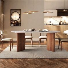 a dining room table with chairs and a rug on the floor