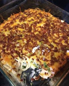 a casserole dish with meat and cheese on it, ready to be eaten