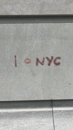 graffiti on the side of a building that says i love nyc written in red