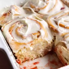 a close up of a cake in a pan with icing