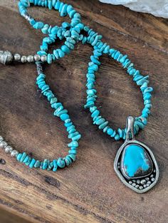 Lovely Turquoise and sterling pendant on a Turquoise chip necklace.  Hand crafted in New Mexico Overall length is approximately 21 inches. The pendant is 1 1/2 inches long and marked R Z on the back.  Unstabilized  turquoise in a beautiful deep teal color. The Turquoise  chips are small.  The ends are finished with sterling beads, cones and a hook fastener.  In very good vintage condition. Very pretty addition to your Southwest collection Chip Necklace, Handcrafted Necklace, Teal Color, Deep Teal, Vintage Turquoise, Necklace Vintage, Turquoise Pendant, Teal Colors, New Mexico