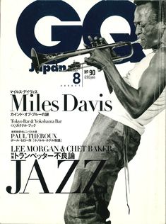 a man holding a trumpet on top of a magazine cover