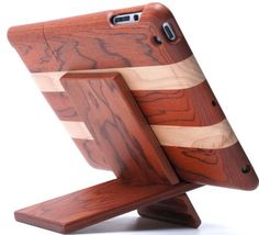 a wooden tablet holder with two pieces of wood on it