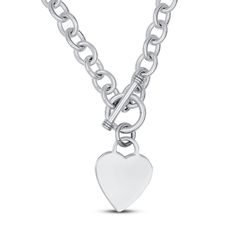 A delicate engravable heart medallion rests gently at the bottom of this dynamic women's necklace. Fashioned in lustrous sterling silver, the 16-inch chain secures in place with a toggle clasp. Chain Heart Necklace, Jared Jewlery, Silver Heart Chain Necklace, Heart Pendant Necklace Silver, Heart Chain Necklace, Pandora Heart, Women's Necklace, Jared The Galleria Of Jewelry, Chunky Chain Necklaces