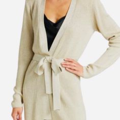 Statement-Making Shoulder Pads Line The Shoulders Of This Ribbed Knit Cardigan With A Belted Waist. V-Neck Long Sleeves Self-Tie Belted Waist 86% Rayon/10% Nylon/4% Metallic Dry Clean Imported Size & Fit About 30" From Shoulder To Hem Model Measurements: 5'10" Tall Model Is Wearing A Us Elegant Beige Knit Sweater Coat, Chic Wrap Sweater For Workwear, Chic Wrap Sweater For Work, Elegant Knit Sweater Coat For Loungewear, Elegant Open Front Cardigan For Loungewear, Elegant Open Front Loungewear Cardigan, Elegant Beige Open Front Sweater, Elegant Wrap Cardigan For Workwear, Elegant V-neck Knit Sweater Coat