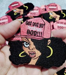 a person holding a bunch of pink patches in their hand with the words get on top of them