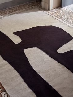 a black and white rug on the floor