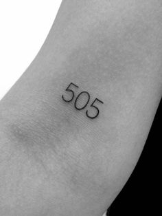 a black and white photo of a person's foot with the number 50 on it