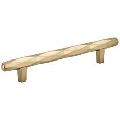 an image of a brass colored handle for a cabinet door or drawer knob on a white background