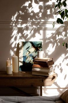 a stack of books sitting on top of a wooden table