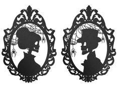 the silhouettes of two women are in an ornate frame with black paper cut outs